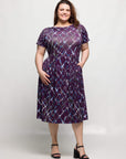 24seven Comfort Apparel Plus Size Purple Print Short Sleeve Pleated Flare Midi Pocket Dress