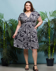24seven Comfort Apparel Plus Size Cap Sleeve Black and White V Neck Knee Length Pocket Dress