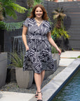 24seven Comfort Apparel Plus Size Cap Sleeve Black and White V Neck Knee Length Pocket Dress